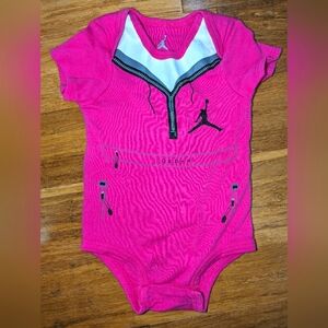 Jordan baby girls pink onesie.